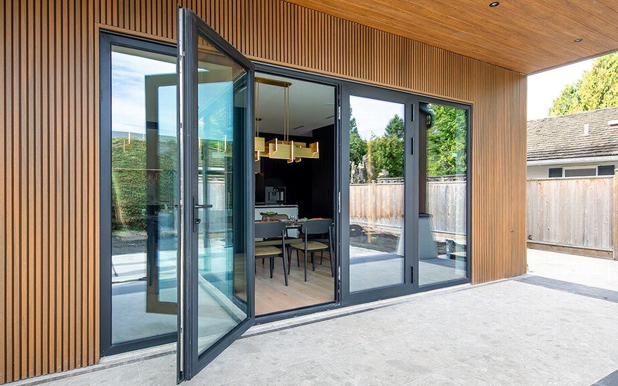 Langton Road. Reynaers French doors with twin fixed sidelites, from the patio.